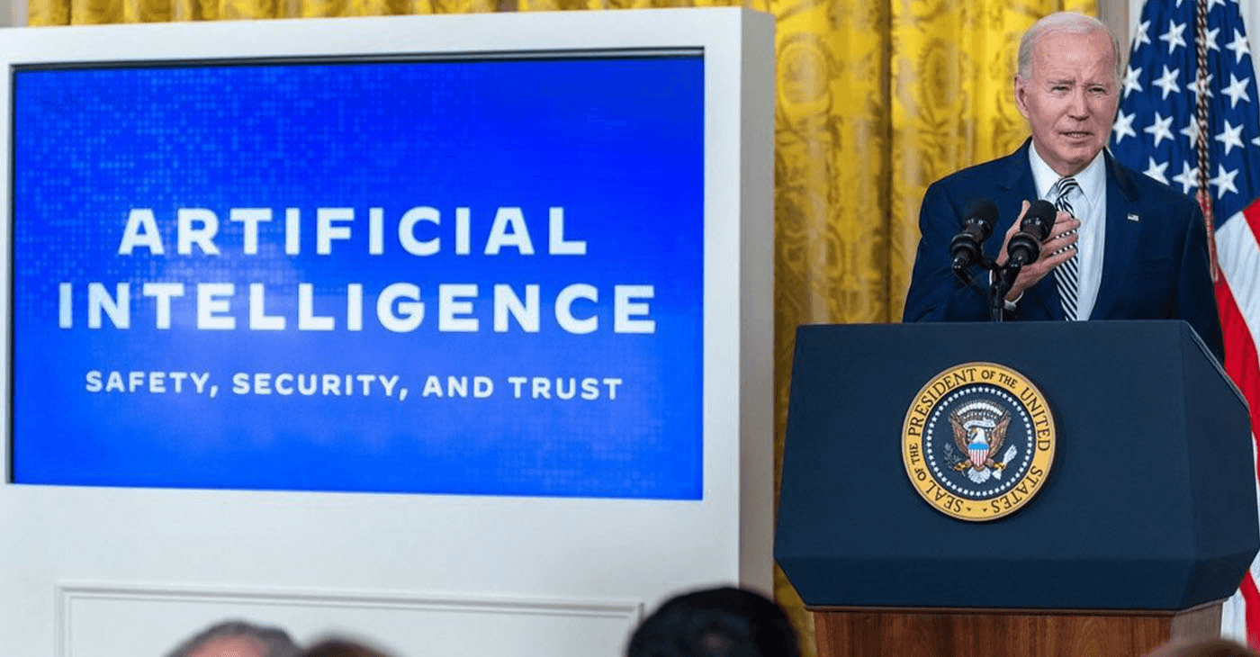 President discussing Artificial Intelligence federal AI governance policy at a press conference highlighting safety, security, and trust. Key focus on US AI governance law